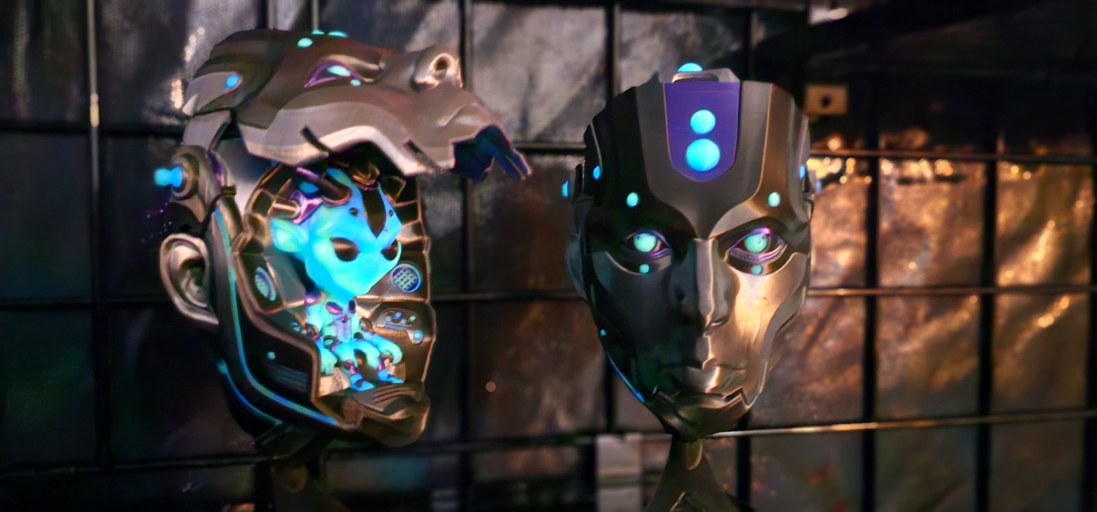 Cyborg head with a glowing blue alien pilot inside, beside a closed cyborg face