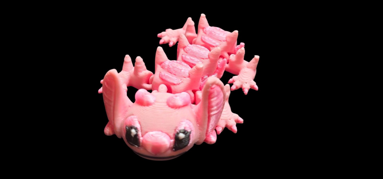 Pink articulated Angel dragon with big ears and a round Angel face