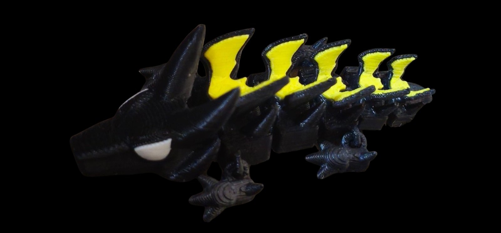 Black articulated Batman dragon with yellow bat-wing spines
