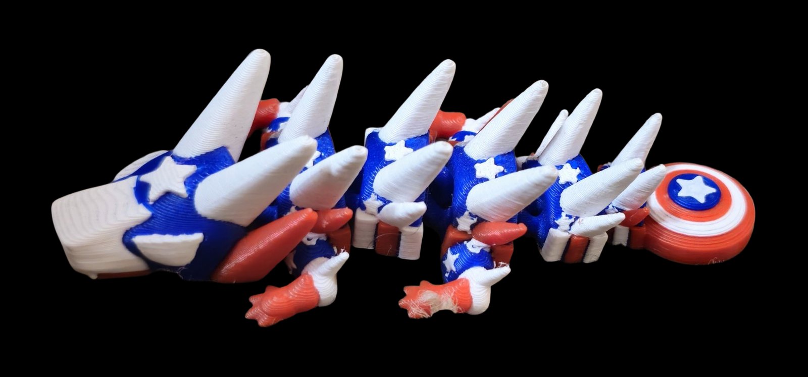 Blue, white and red articulated Captain America dragon with stars and a shield tail