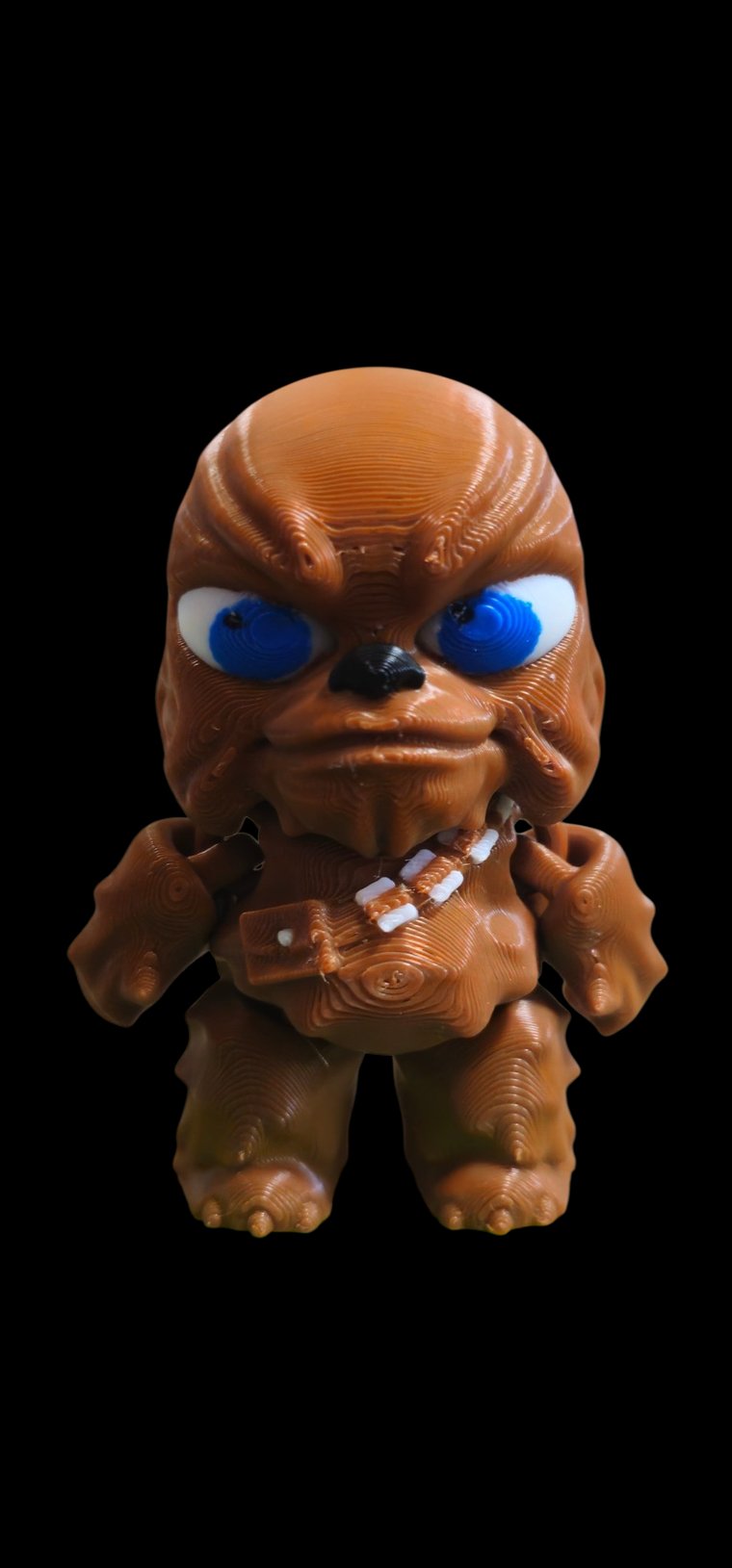 Mini brown Chewbacca figure with blue eyes and a bandolier