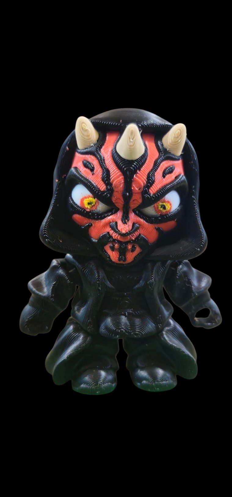 Mini Darth Maul figure with red and black face, horns and a black hooded robe
