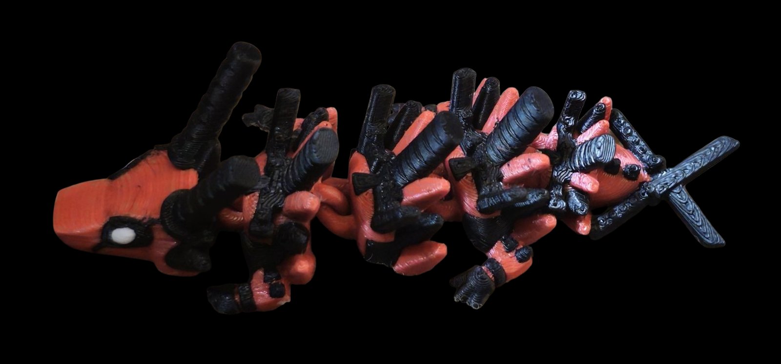 Red and black articulated Deadpool dragon with crossed katanas on the tail