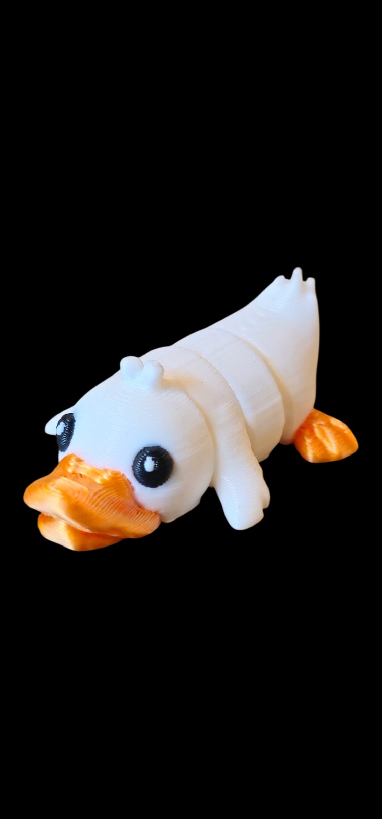 Articulated white duck with an orange bill and orange feet