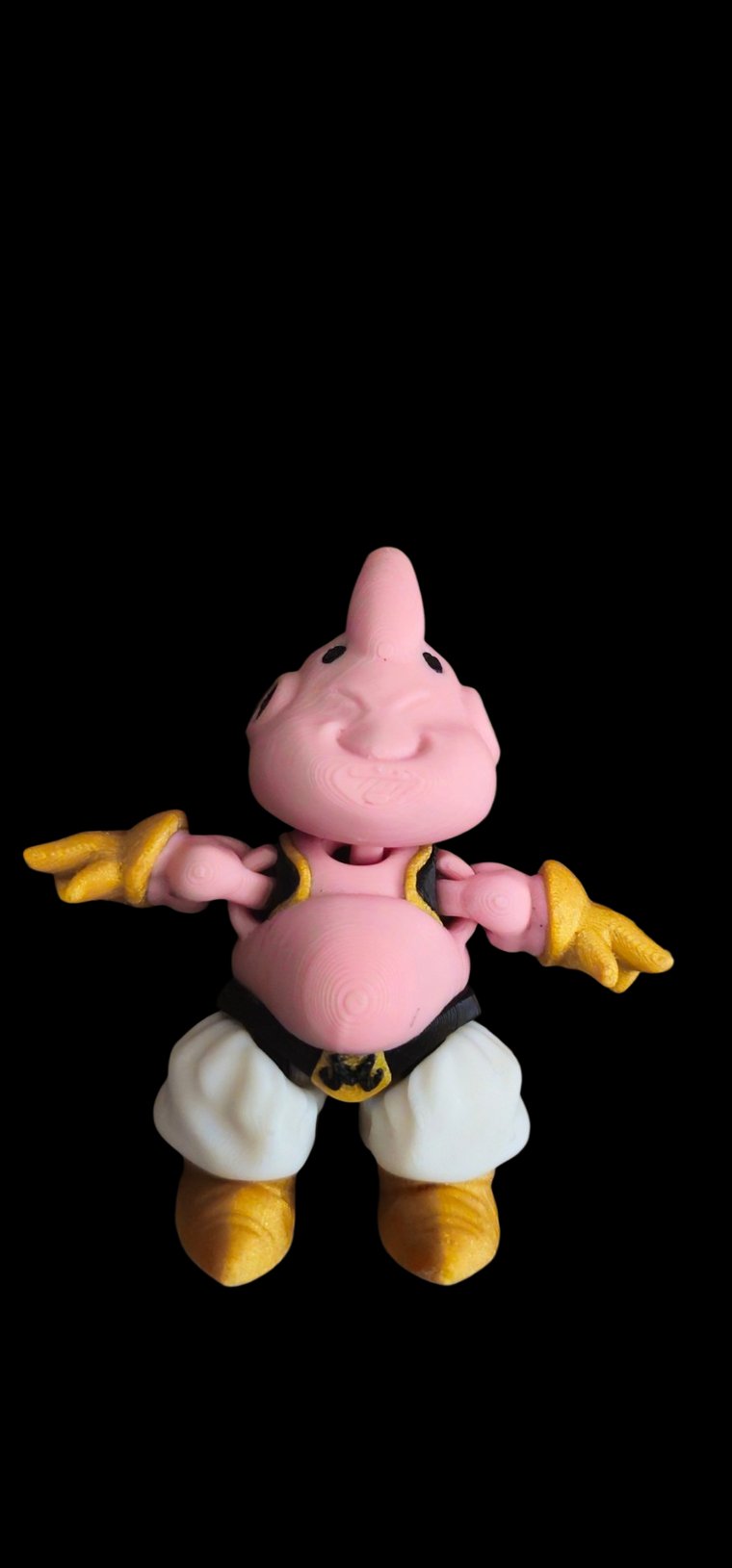 Mini pink Majin Buu figure with white pants and a black vest