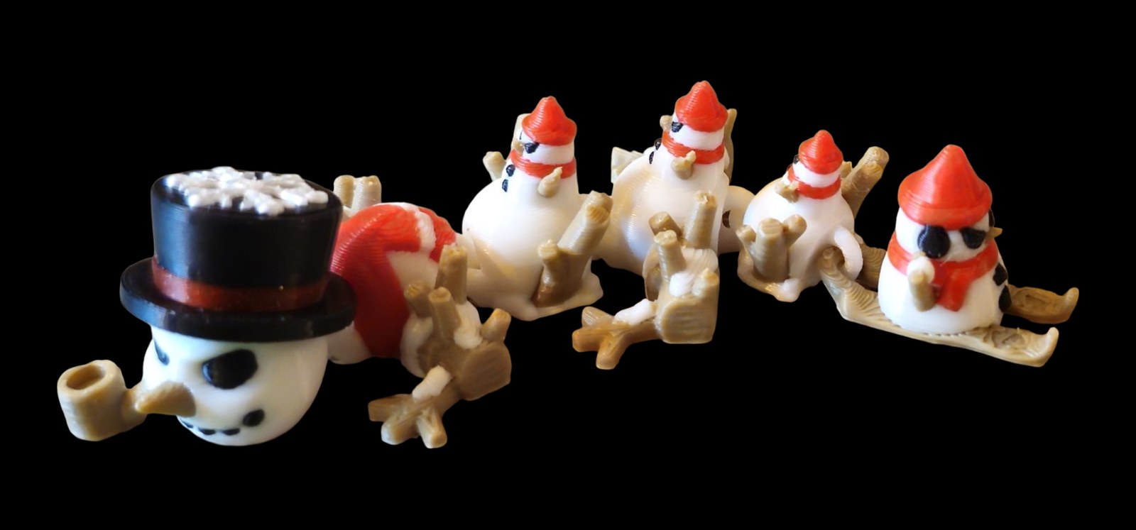 Articulated snowman dragon with a black top hat, pipe, carrot nose and little snowmen along its back