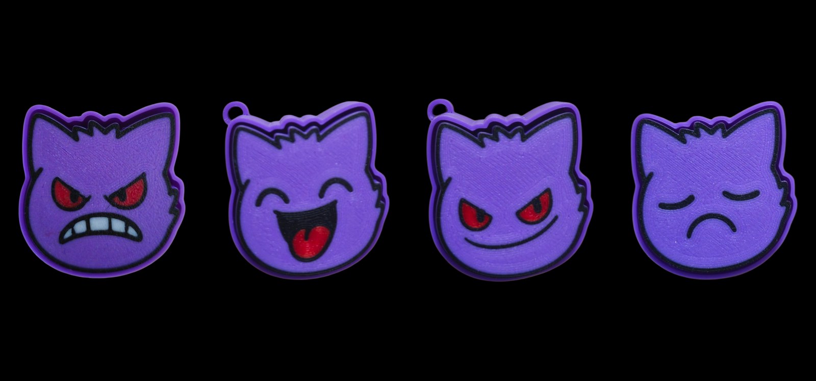 Four purple Gengar fidget clickers with angry, laughing, sly grin and grumpy faces