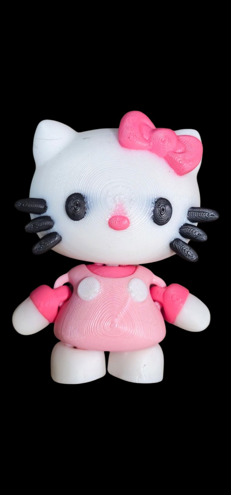 Mini Hello Kitty figure with a pink bow and pink outfit