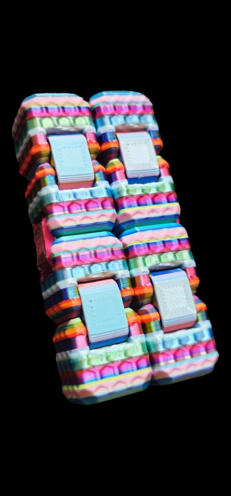 Rainbow-striped infinity cube fidget that folds over and over