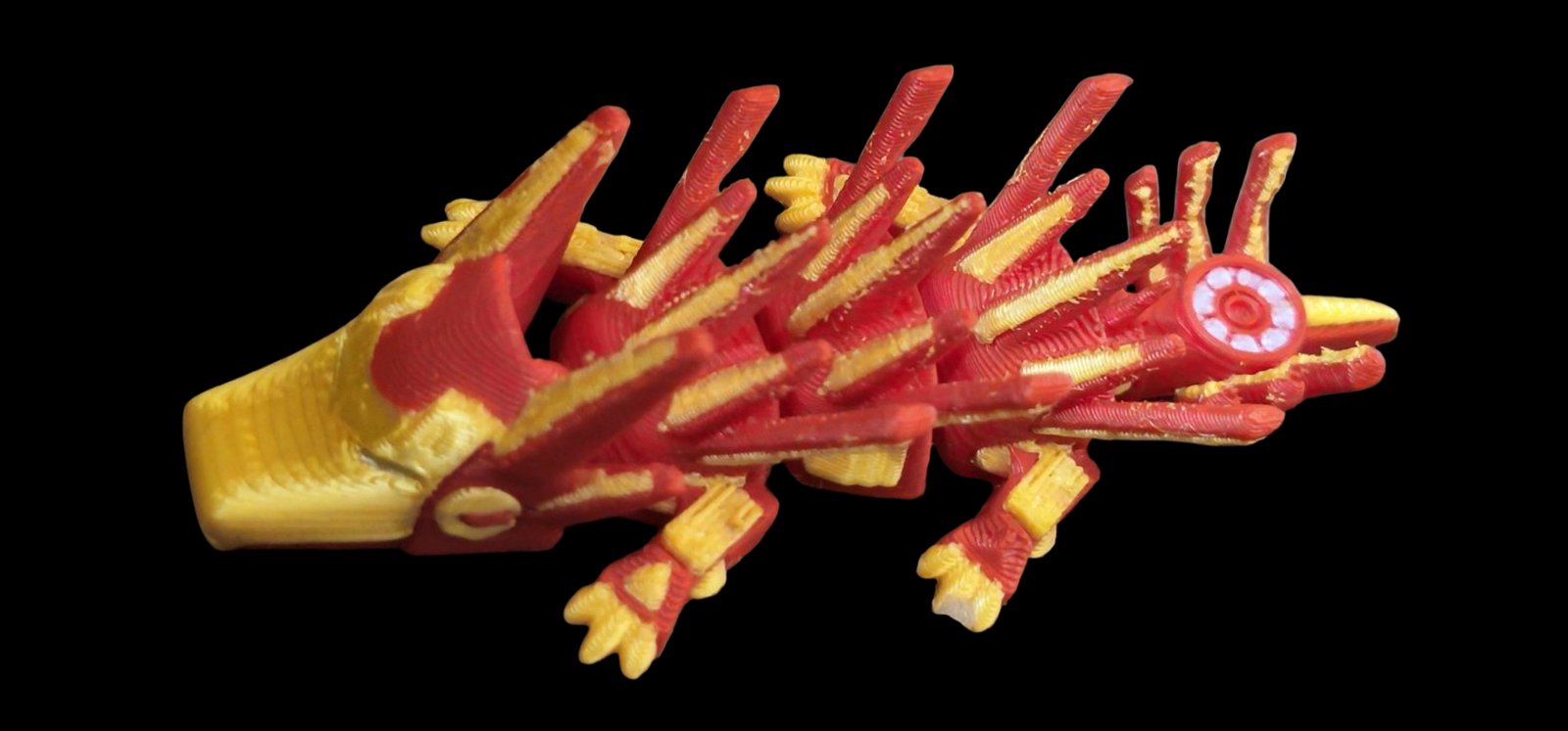 Red and gold articulated Iron Man dragon with an arc reactor