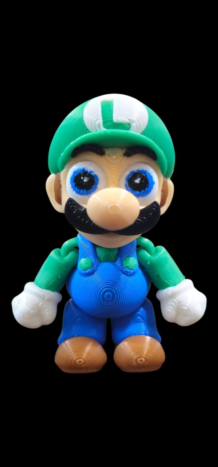 Mini Luigi figure with green cap and blue overalls