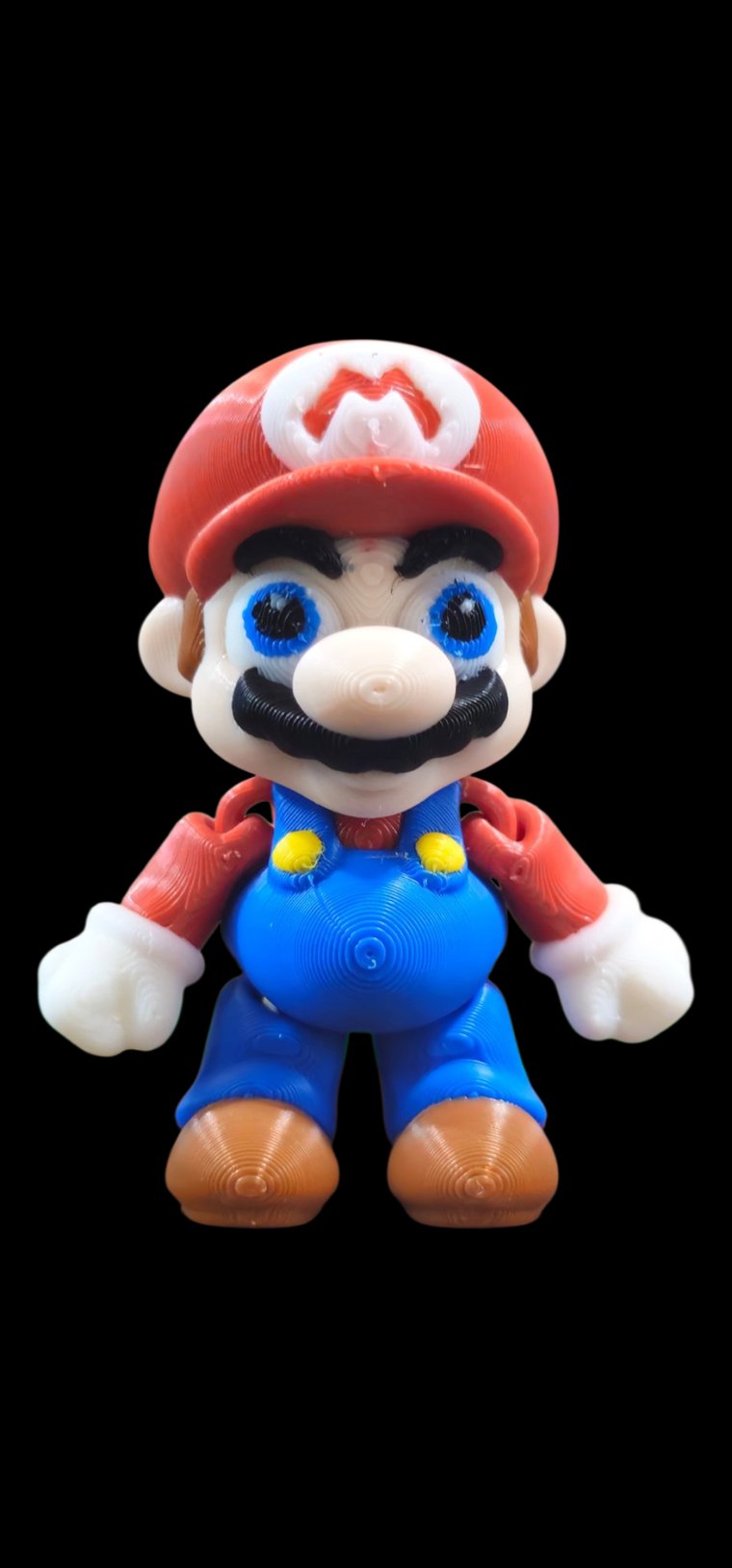 Mini Mario figure with red cap and blue overalls