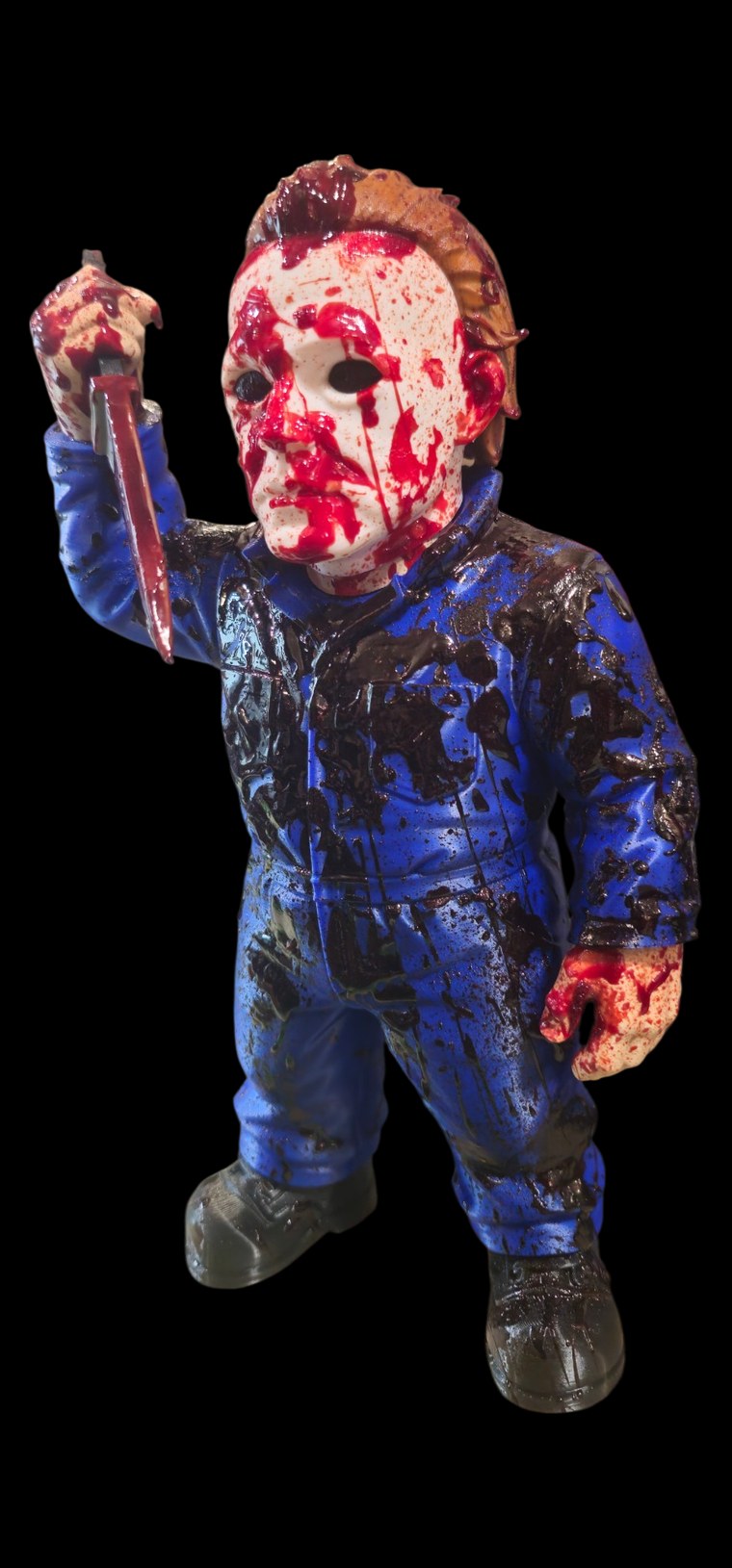 Hand-painted blood-splattered Michael Myers figure in a white mask and blue coveralls raising a kitchen knife