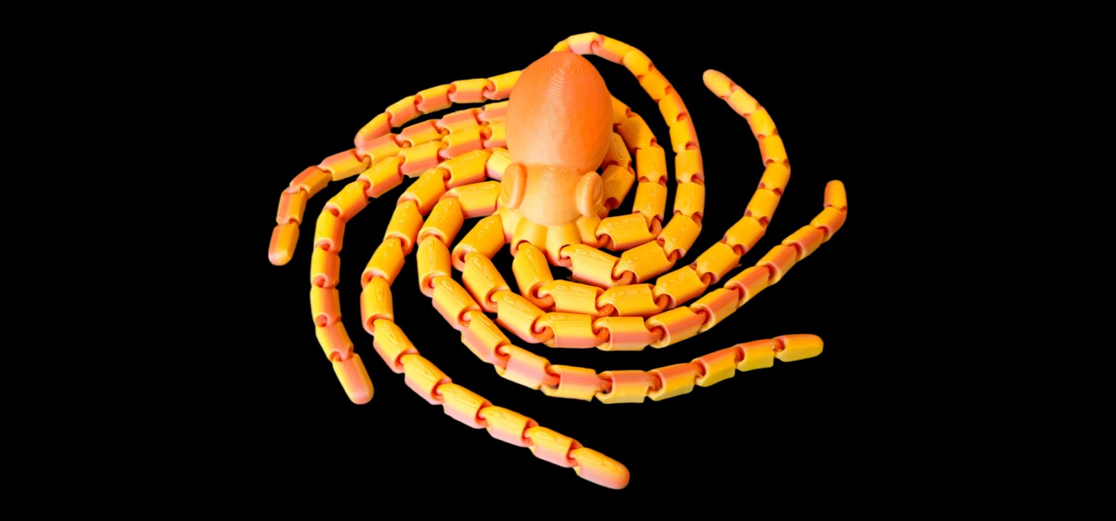 Articulated orange and yellow octopus with long jointed curling arms