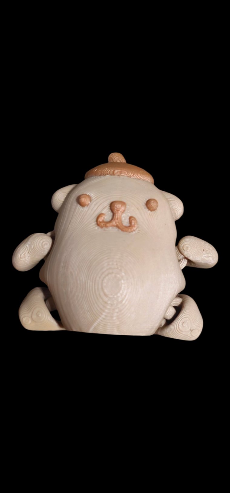 Mini Pompompurin figure in tan with a little brown beret