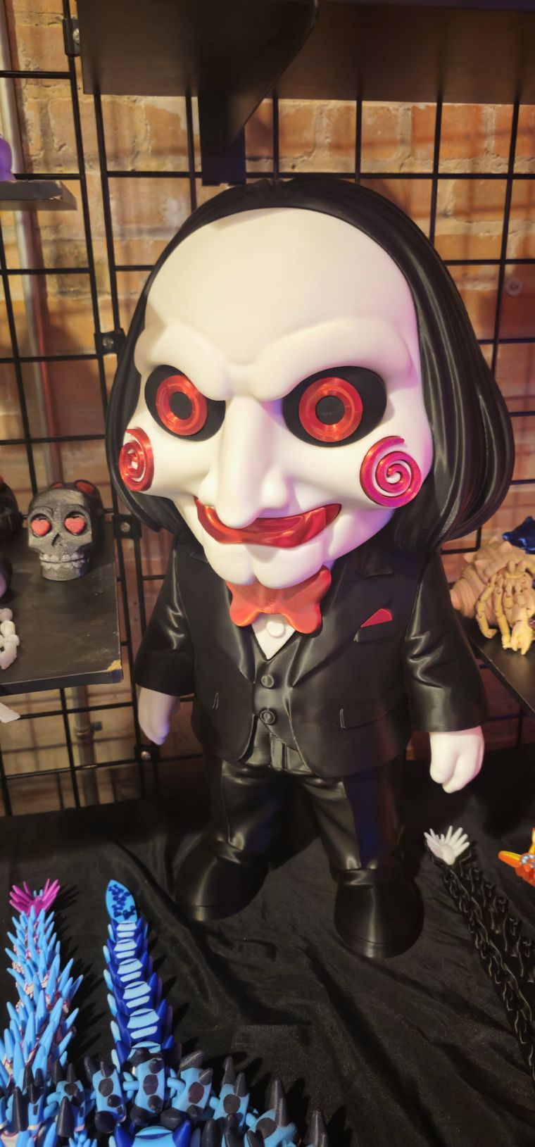 Large hand-finished Billy puppet figure with a white face, red spirals and a black suit