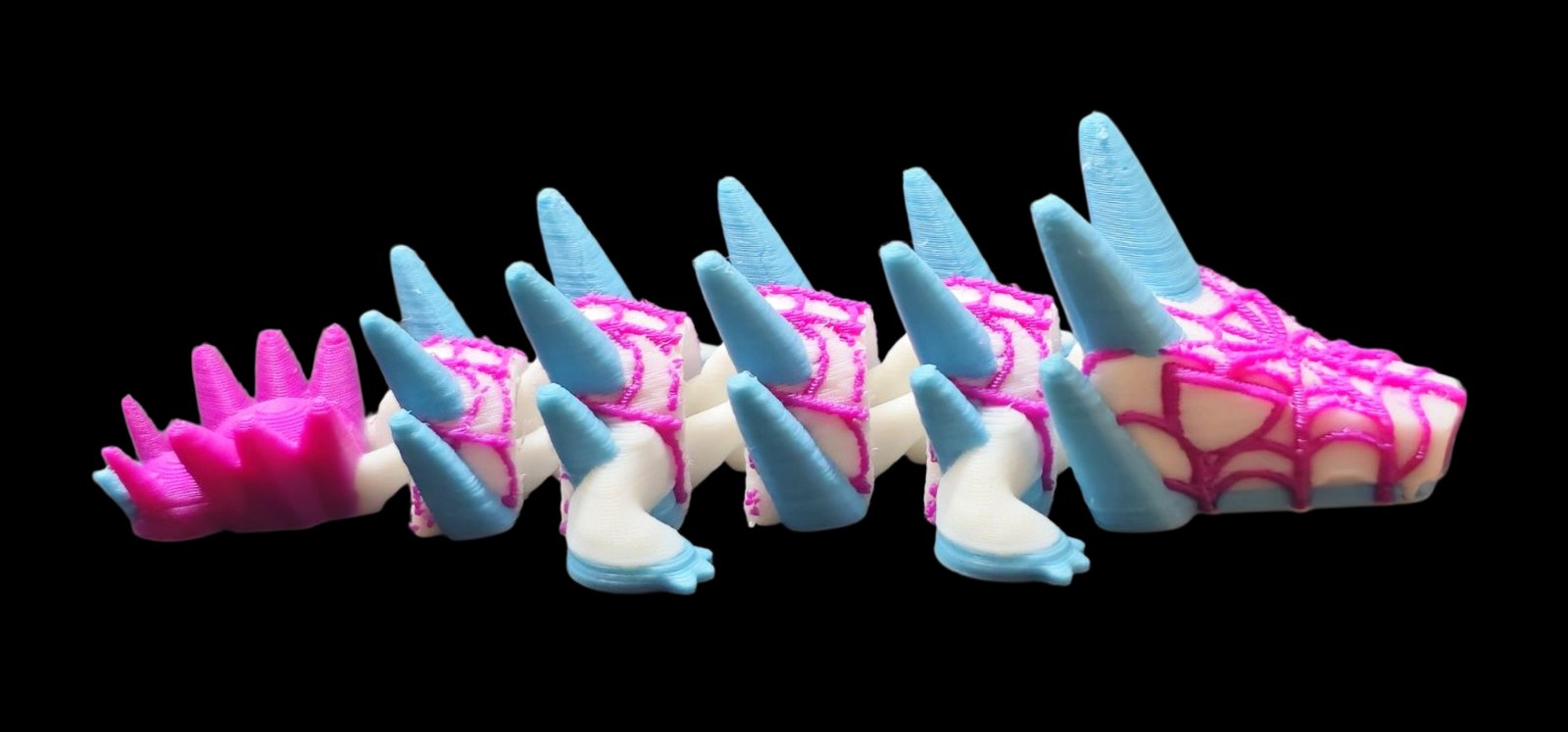 White articulated Spider-Gwen dragon with pink web lines and light blue spikes