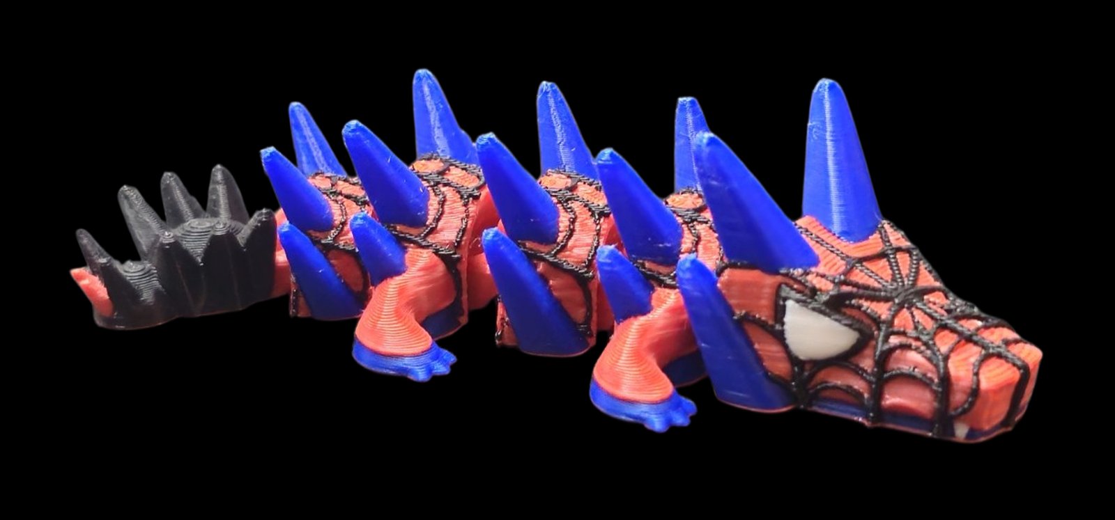 Red articulated Spider-Man dragon with black web lines and blue spikes