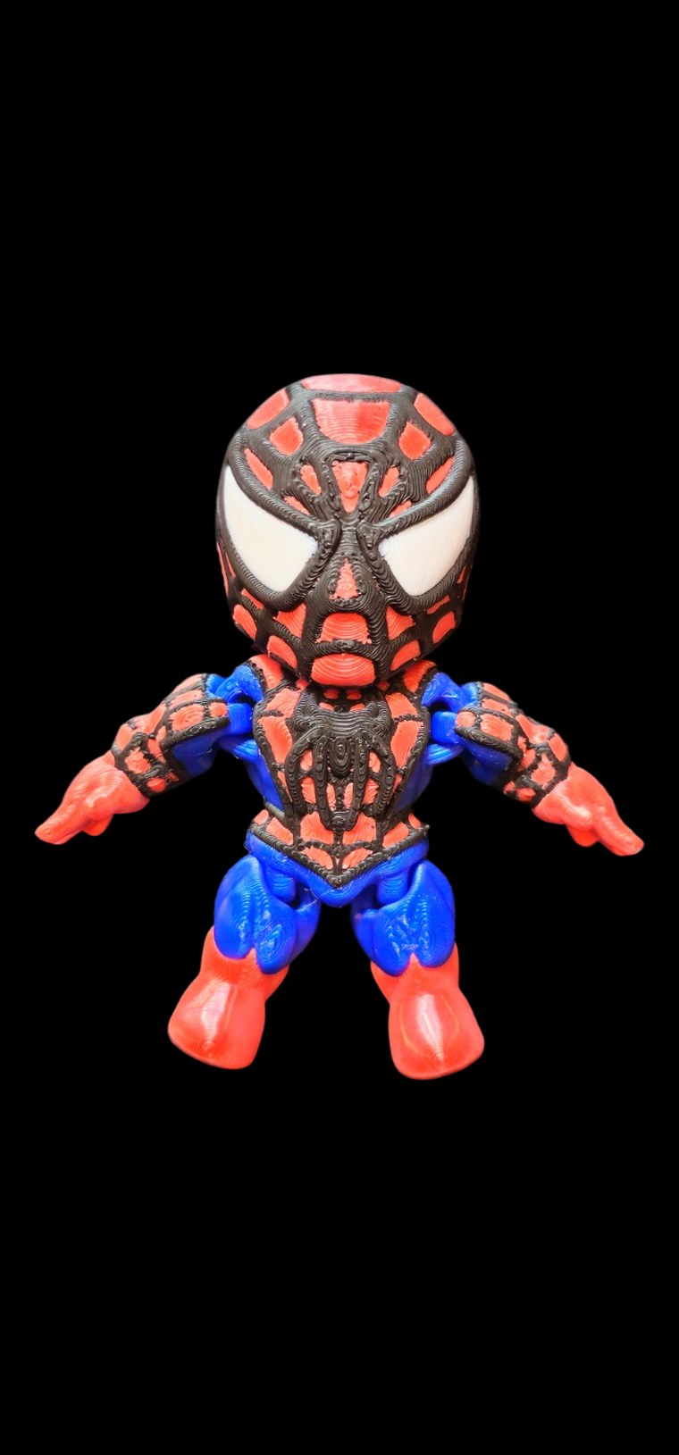 Small articulated Spider-Man figure in red and blue with black web lines