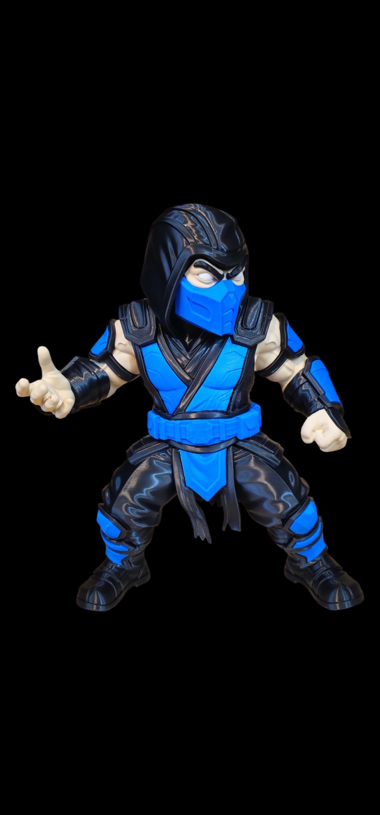 Sub-Zero from Mortal Kombat figure in a fighting stance with black hood, icy blue mask and blue and black ninja armor