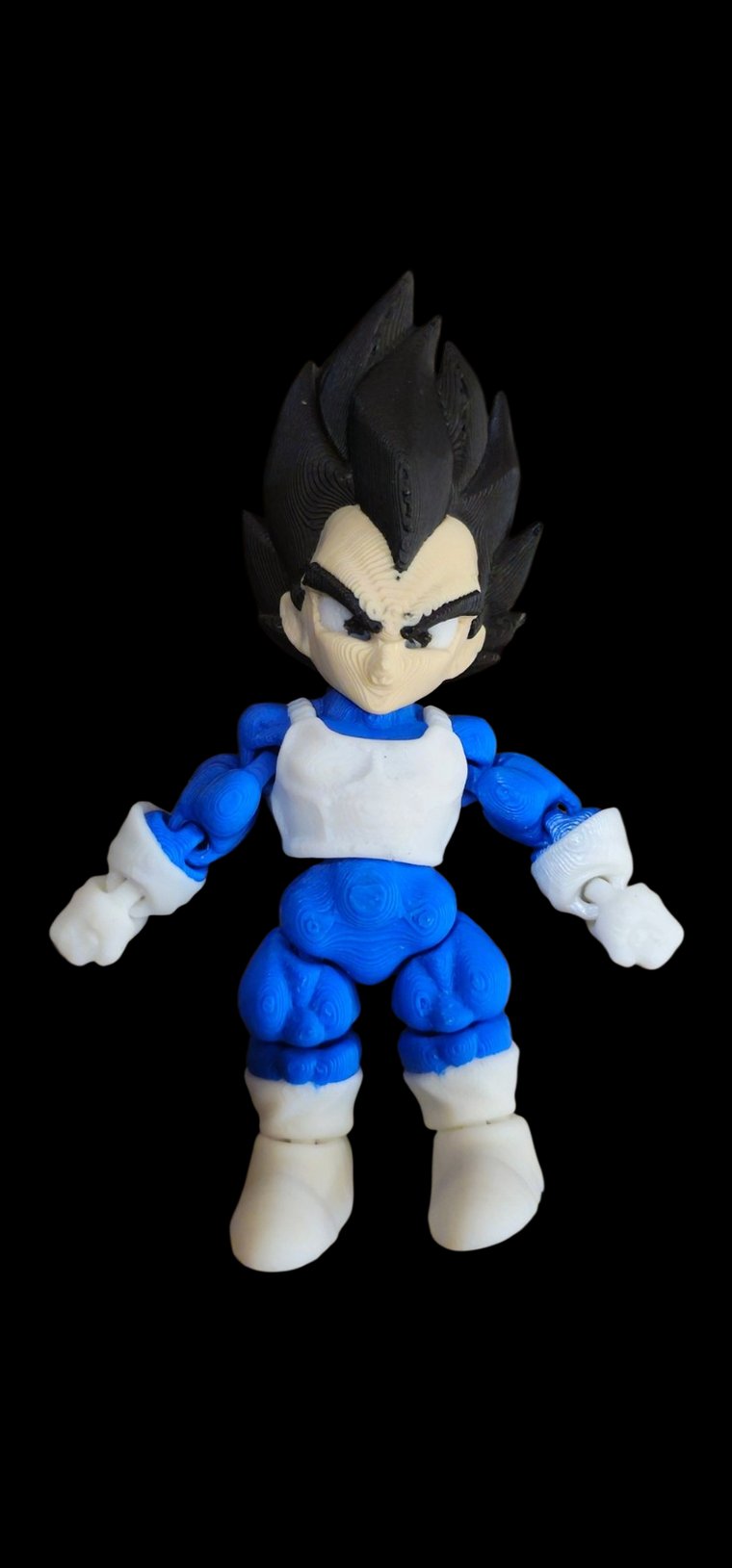 Mini Vegeta figure with black flame hair and white and blue armor