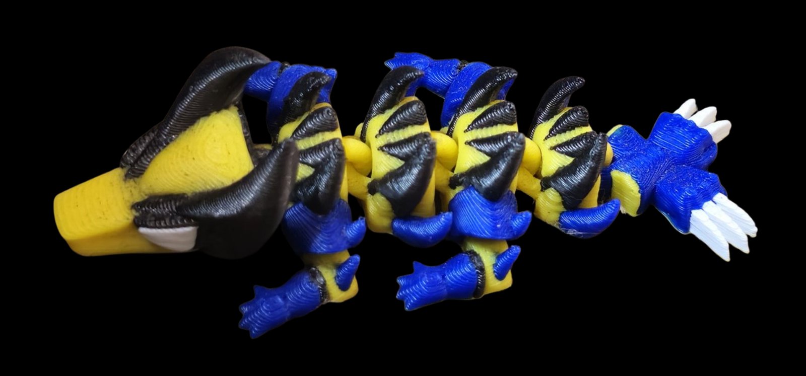 Yellow, blue and black articulated Wolverine dragon with claws on the tail